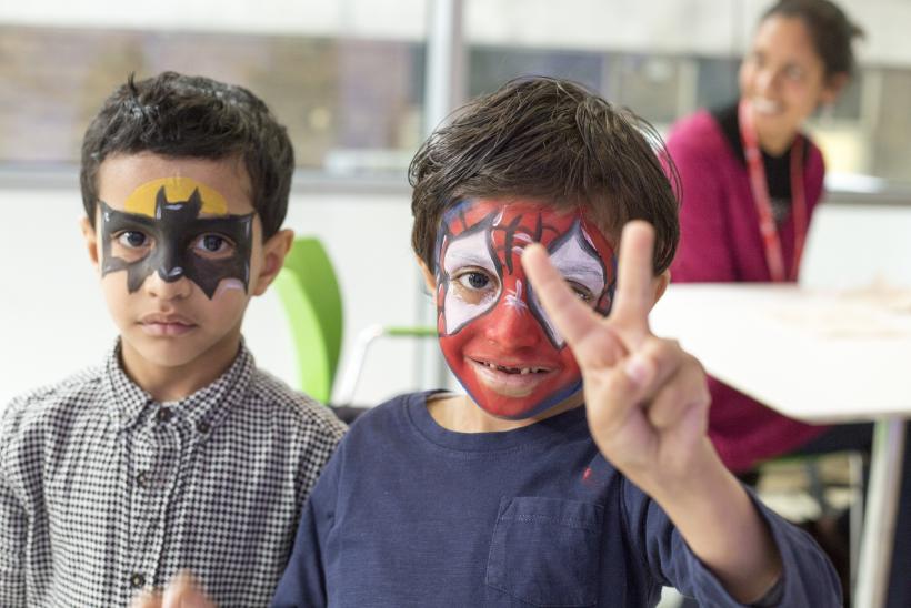 Two boys posing with facepaint 