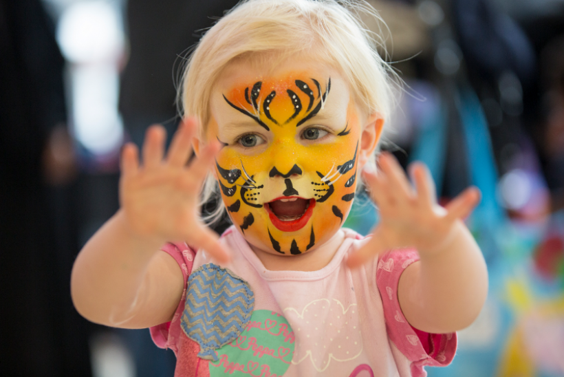 Child with tiger facepaint