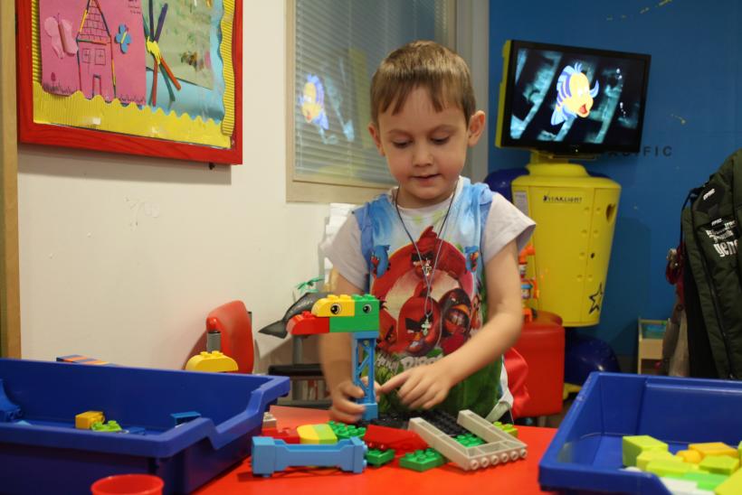 Vasili playing lego at Caterpillar