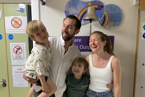 Eddie and family ringing the bell